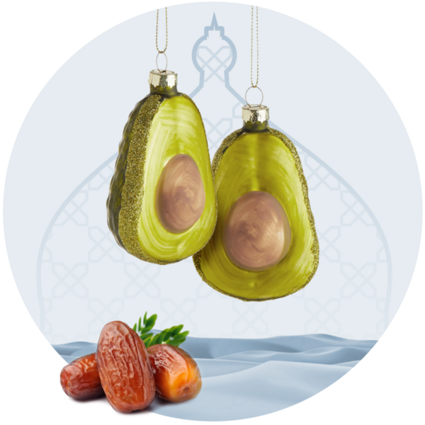 Zwei avocado-Weihnachtskugeln und Datteln